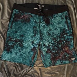 Pelagic Black and Teal Board Shorts